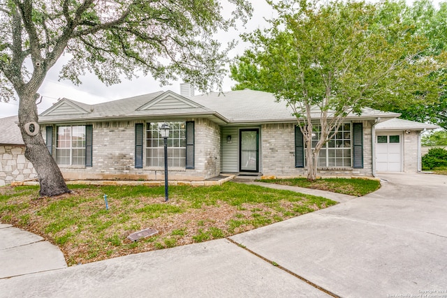 ranch-style home with a garage