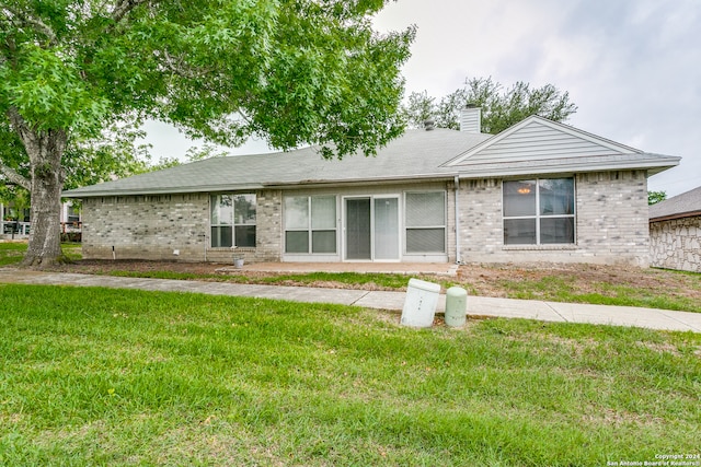 ranch-style house with a front lawn