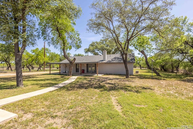 ranch-style house with a front lawn