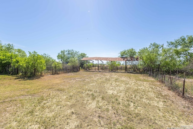 view of yard with a rural view