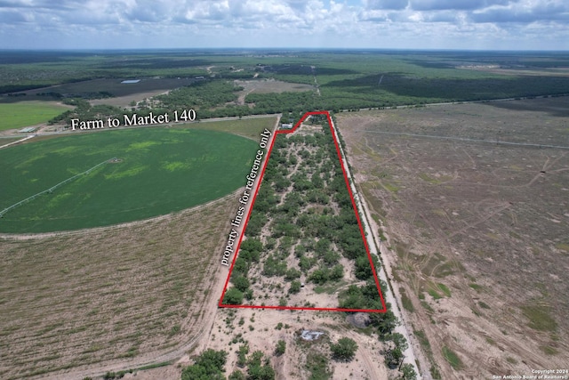 birds eye view of property featuring a rural view