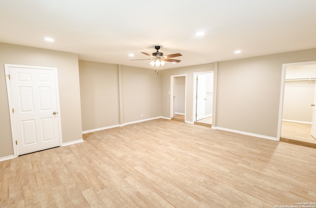 spare room with ceiling fan and light hardwood / wood-style flooring