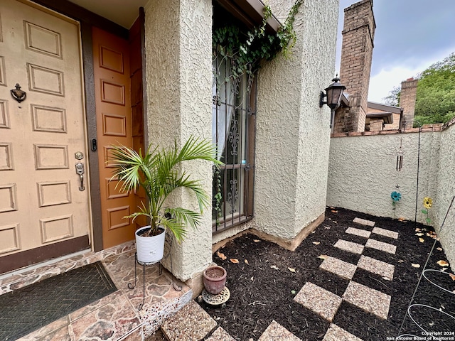 entrance to property with a patio