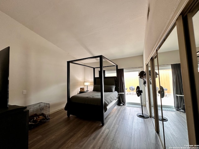 bedroom featuring dark hardwood / wood-style flooring