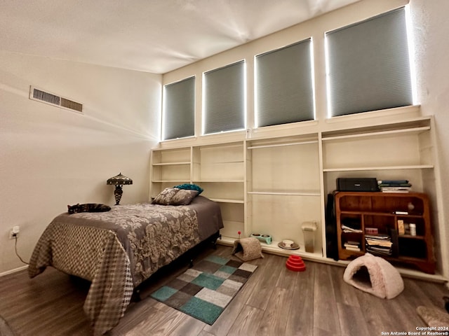 bedroom featuring dark hardwood / wood-style floors