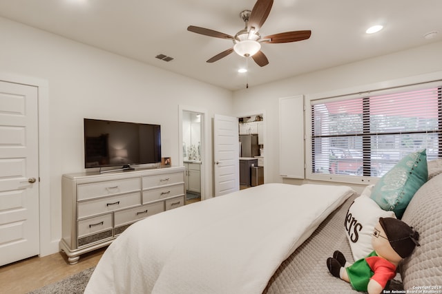 bedroom with connected bathroom and ceiling fan