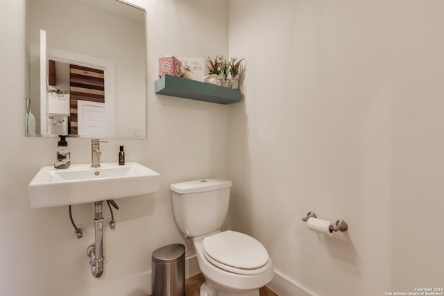 bathroom with sink and toilet