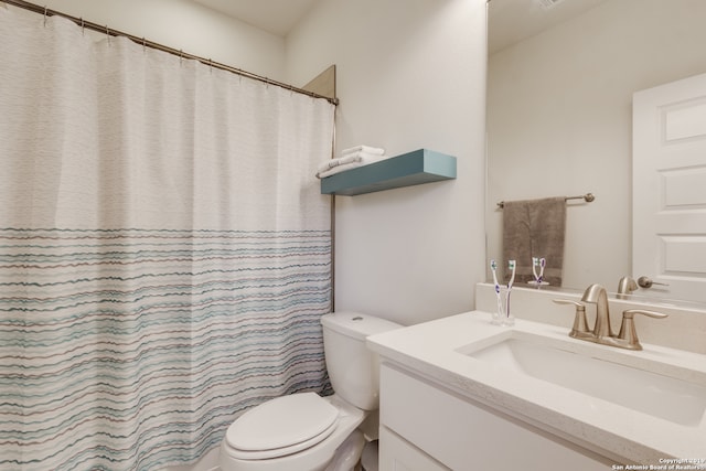 bathroom featuring oversized vanity and toilet