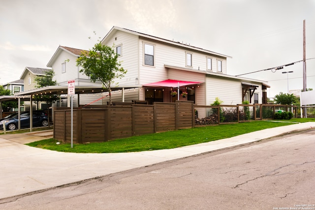 view of front of house featuring a carport