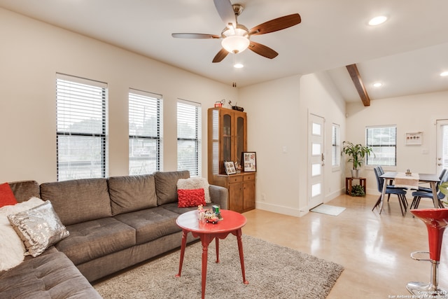 living room with ceiling fan and vaulted ceiling with beams