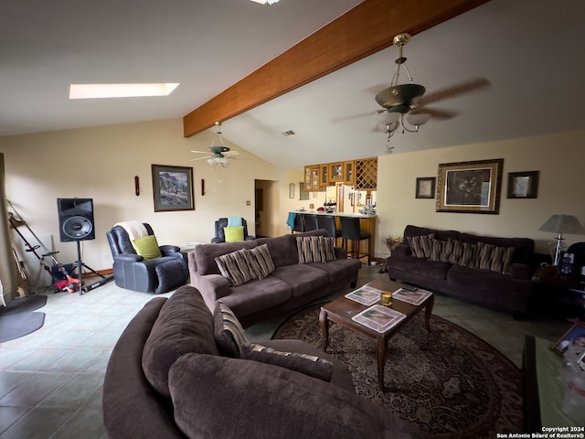 living room with lofted ceiling with beams, ceiling fan, and light tile floors