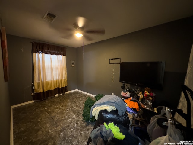 tiled bedroom featuring ceiling fan