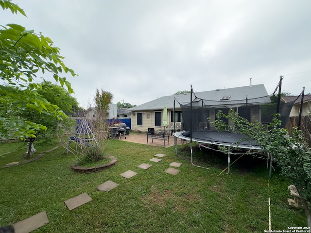 view of yard featuring a patio and a trampoline