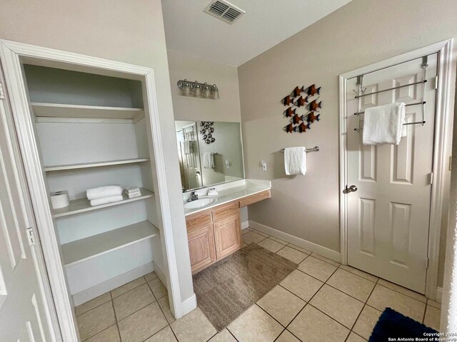 54 Pelican Prt, Oconnor, TX 77982 - bathroom featuring vanity with extensive cabinet space and tile flooring
