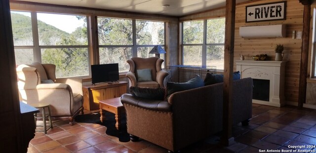 sunroom featuring a healthy amount of sunlight and vaulted ceiling