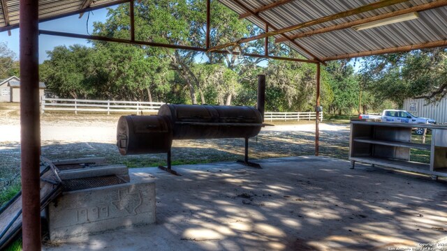 exterior space featuring vaulted ceiling