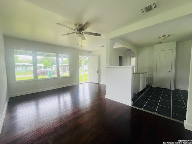 empty room featuring ceiling fan and dark hardwood / wood-style floors