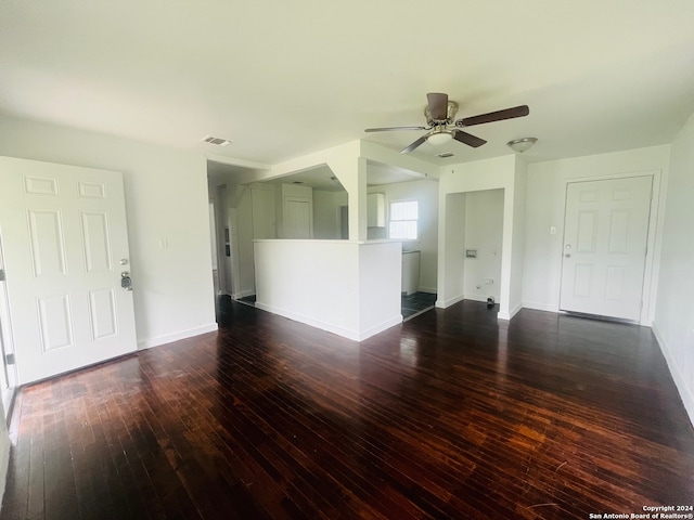 empty room featuring dark hardwood / wood-style flooring and ceiling fan