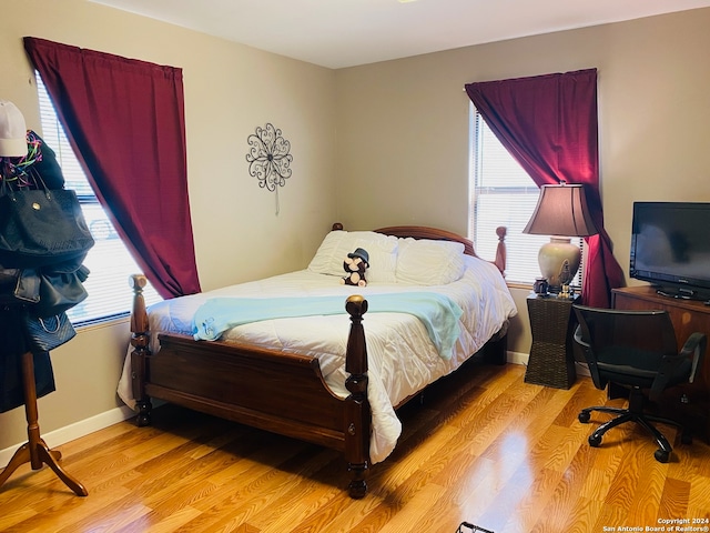 bedroom with light wood-type flooring