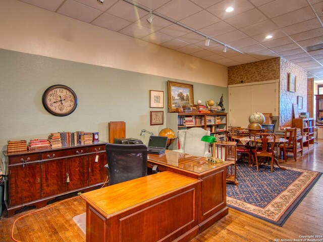 office area featuring rail lighting and light wood-type flooring