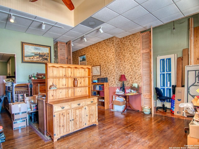 misc room with hardwood / wood-style flooring and track lighting