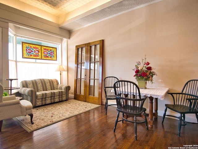 sitting room featuring french doors and dark wood-type flooring