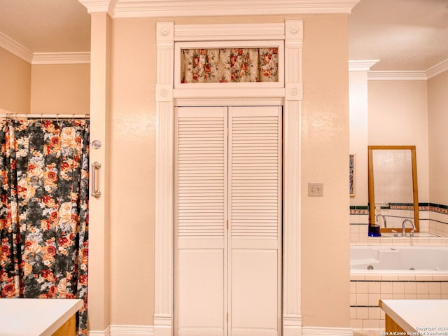 bathroom featuring vanity, a relaxing tiled tub, and ornamental molding