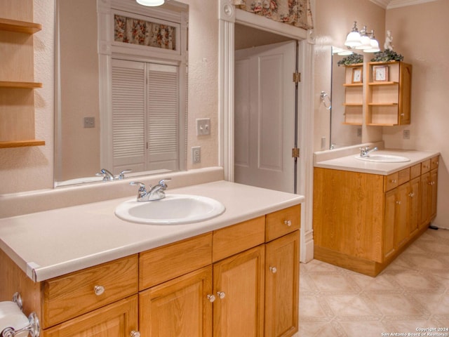 bathroom with vanity and crown molding