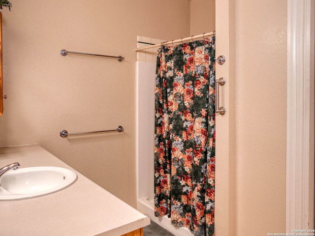 bathroom featuring vanity and a shower with shower curtain