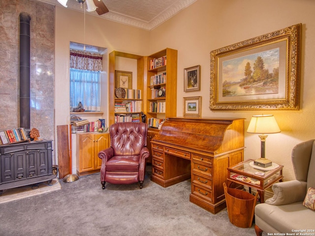 sitting room with light carpet and a wood stove