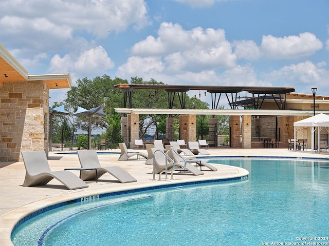 view of swimming pool with a patio area