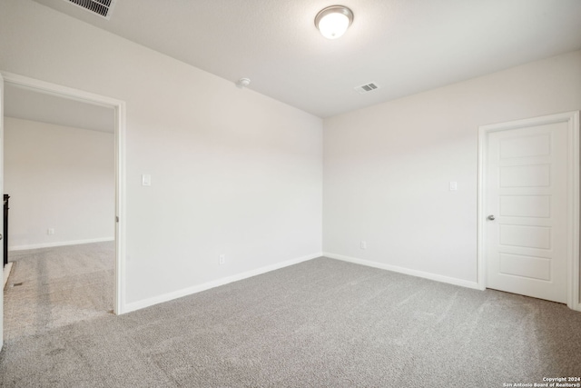 spare room featuring carpet