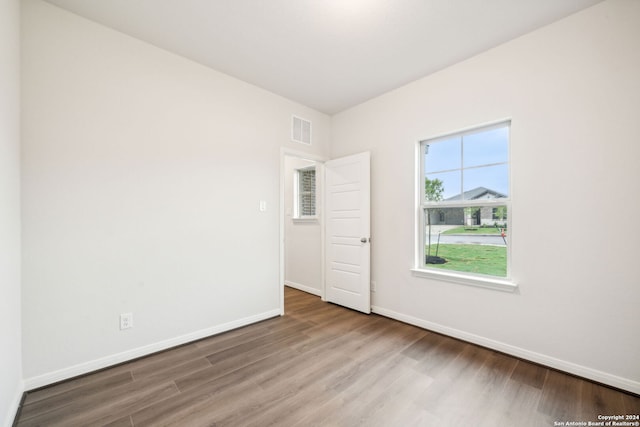 empty room featuring hardwood / wood-style flooring