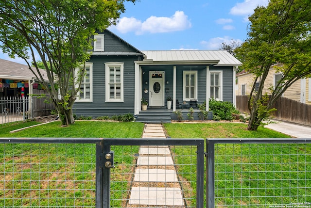 view of front of home with a front yard and a porch