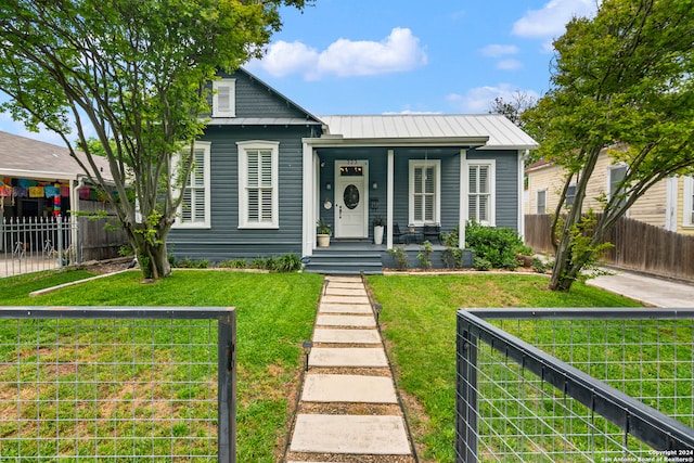 bungalow-style house with a porch and a front lawn