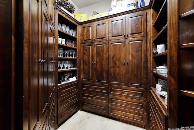 spacious closet featuring light tile floors