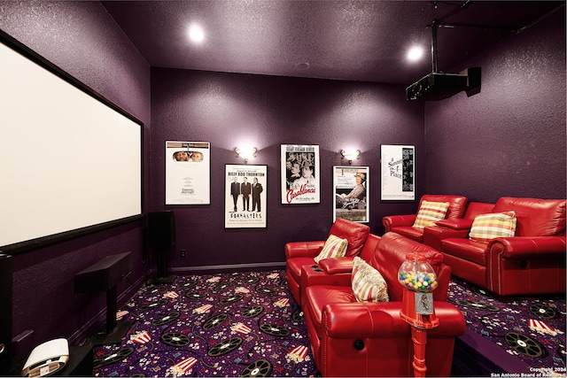 home theater featuring a textured ceiling and dark colored carpet