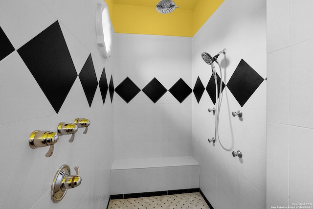 bathroom with a tile shower