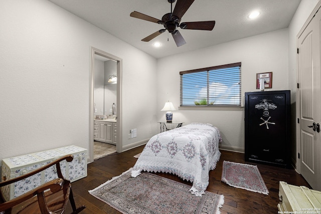 bedroom with ensuite bath, ceiling fan, and dark wood-type flooring