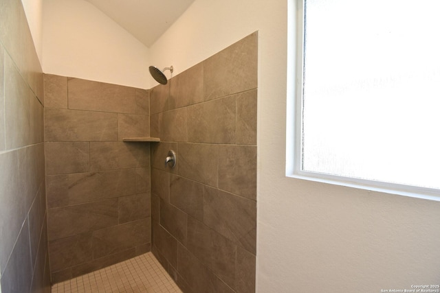 full bath with tiled shower