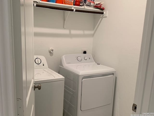 clothes washing area featuring independent washer and dryer and electric dryer hookup