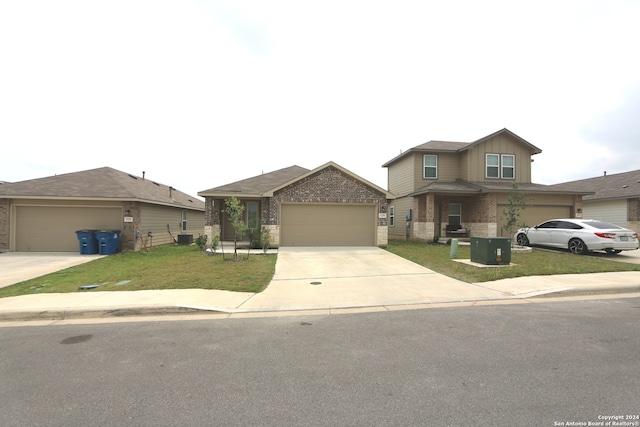 view of front of house with a garage and a front lawn