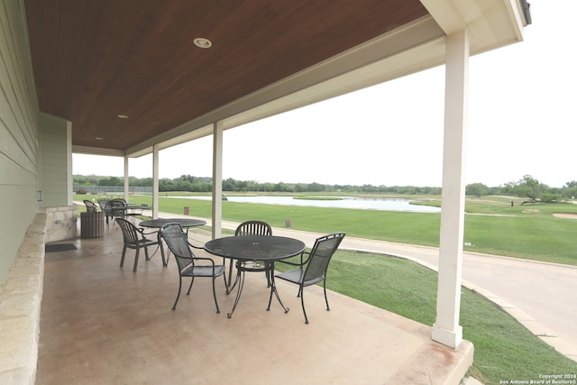 view of terrace with a water view