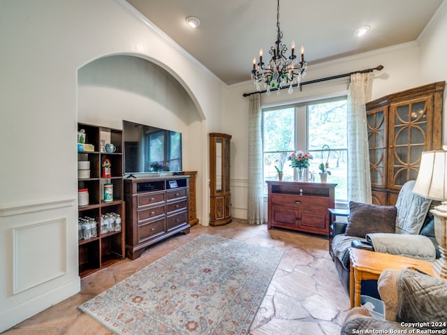 sitting room featuring ornamental molding, an inviting chandelier, and light tile floors