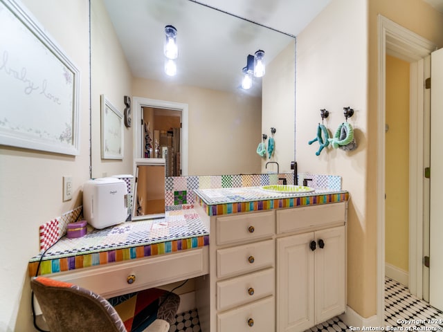 bathroom with vanity and tile floors