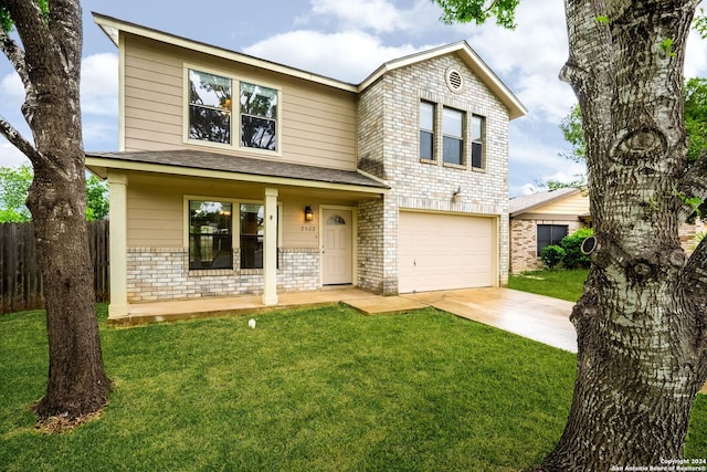 front of property featuring a front yard and a garage