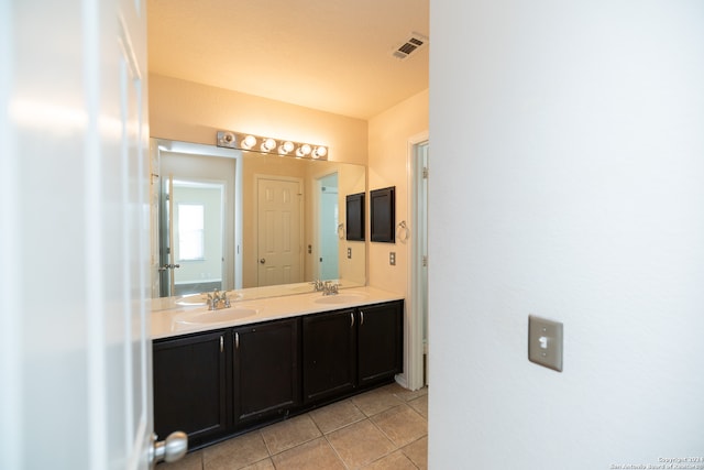 bathroom featuring double sink vanity and tile floors