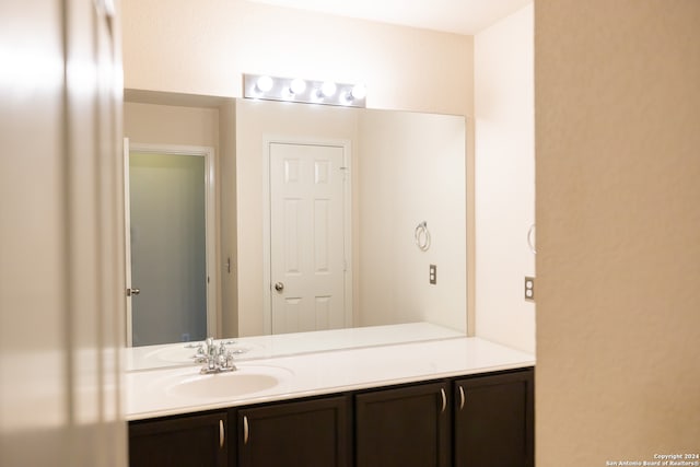 bathroom with vanity with extensive cabinet space