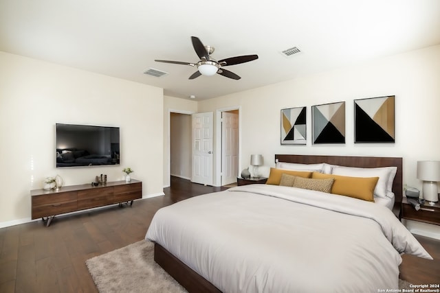 bedroom featuring dark hardwood / wood-style flooring and ceiling fan