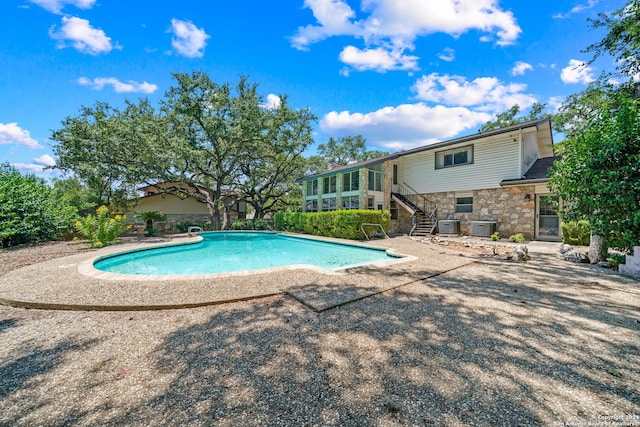 view of swimming pool with a patio area